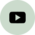 Ein schwarzes, stilisiertes Wiedergabesymbol (Play-Button) auf einem hellen Hintergrund.